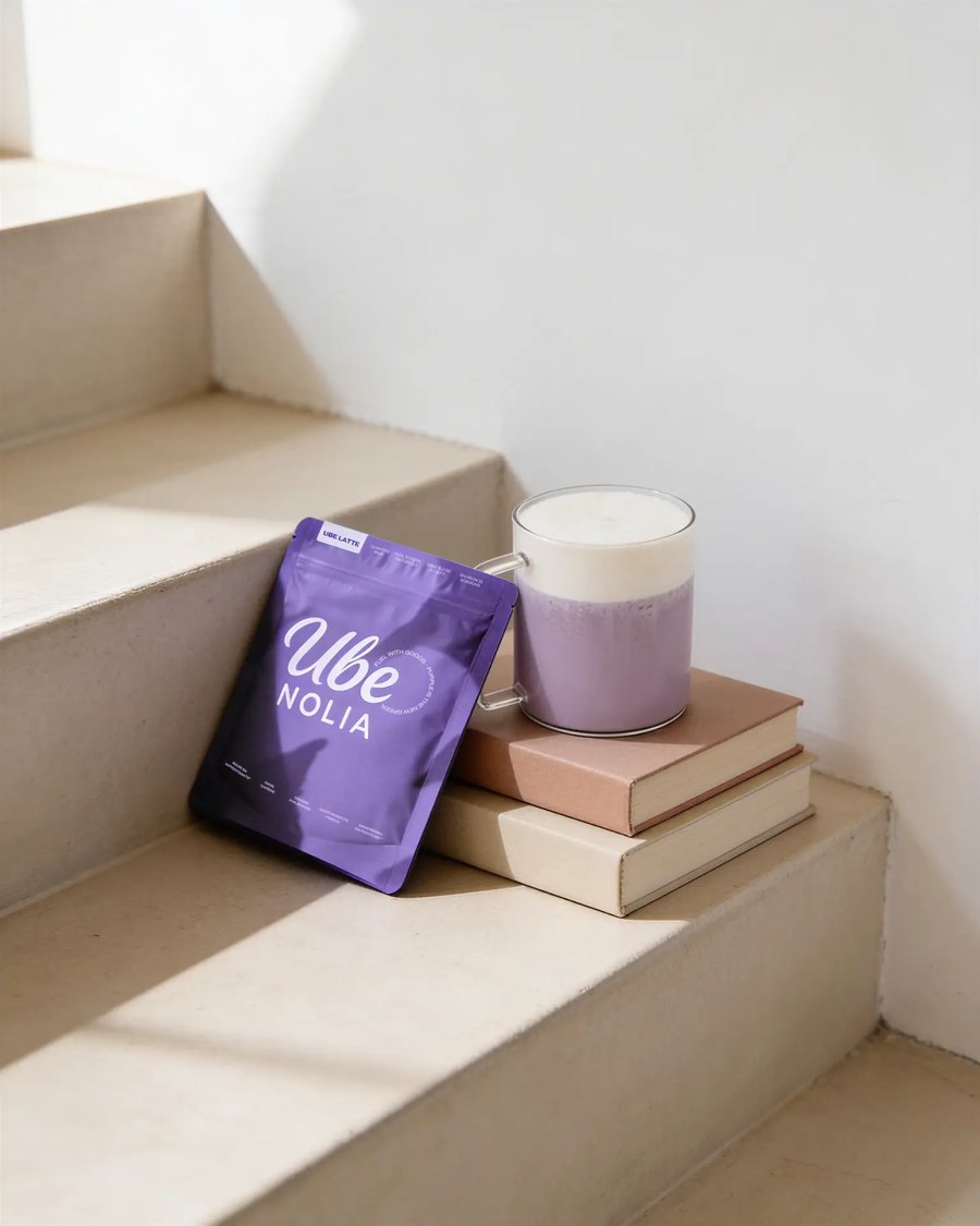 Ube Nolia 100% pure ube powder pouch with a fresh ube latte