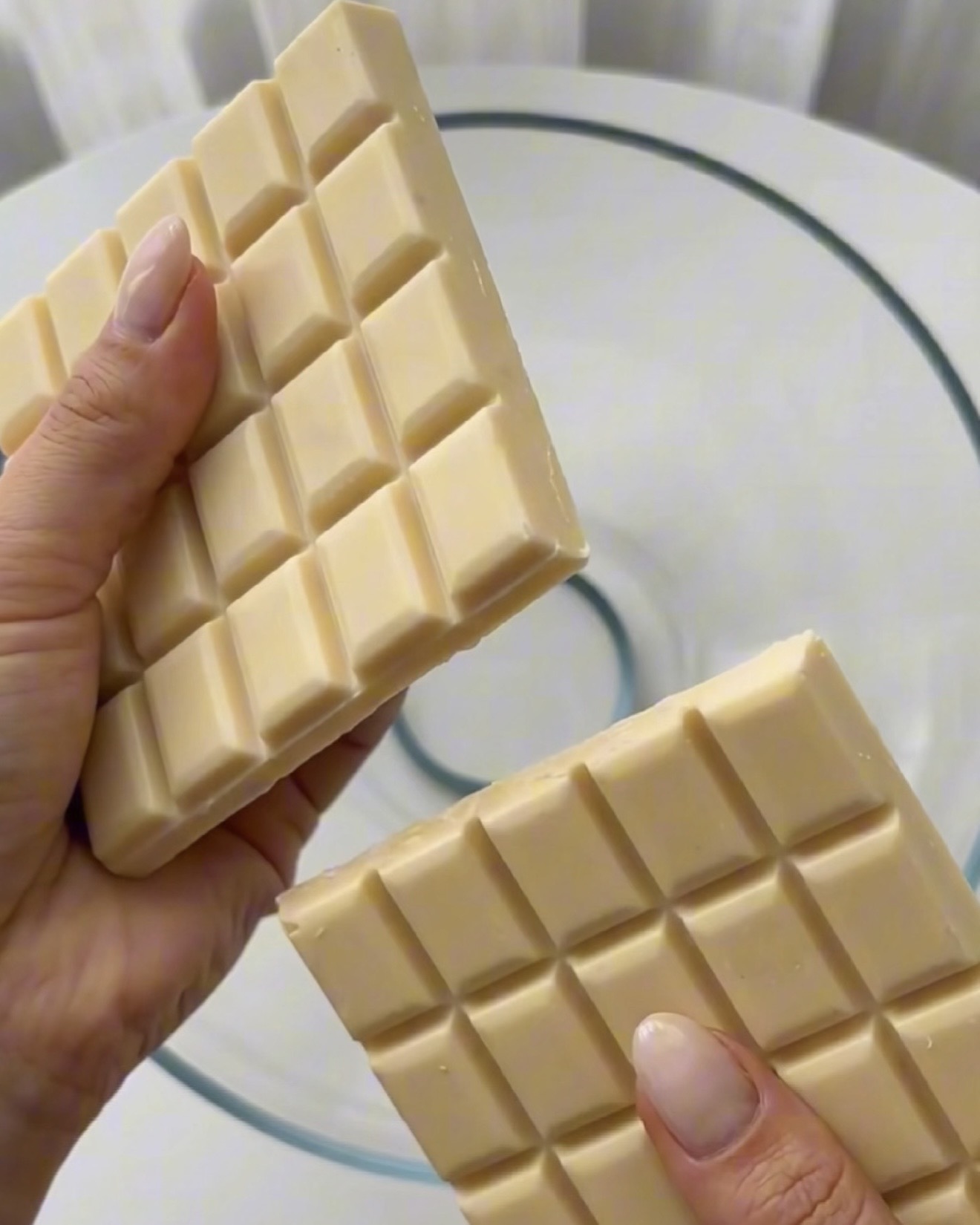 Melting white chocolate in a bowl for Ube Nolia ube pistachio quinoa bites