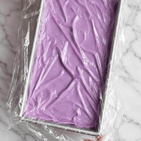Ube ice cream covered with plastic wrap, ready for the freezer, purple yam | Ube Nolia