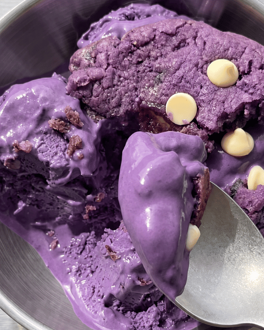 Bowl of ube ice cream topped with an ube white chocolate cookie, purple yam | Ube Nolia