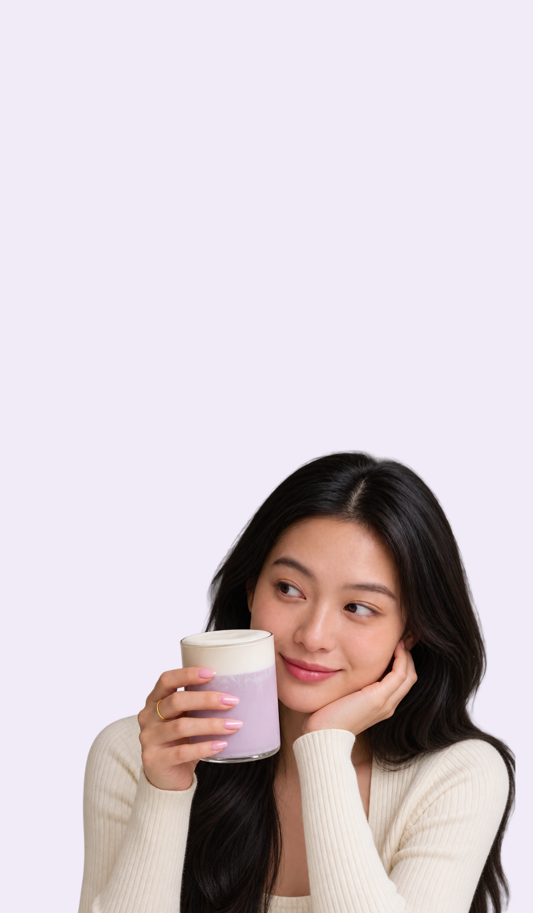 Woman holding a creamy ube latte made with Ube Nolia ube powder