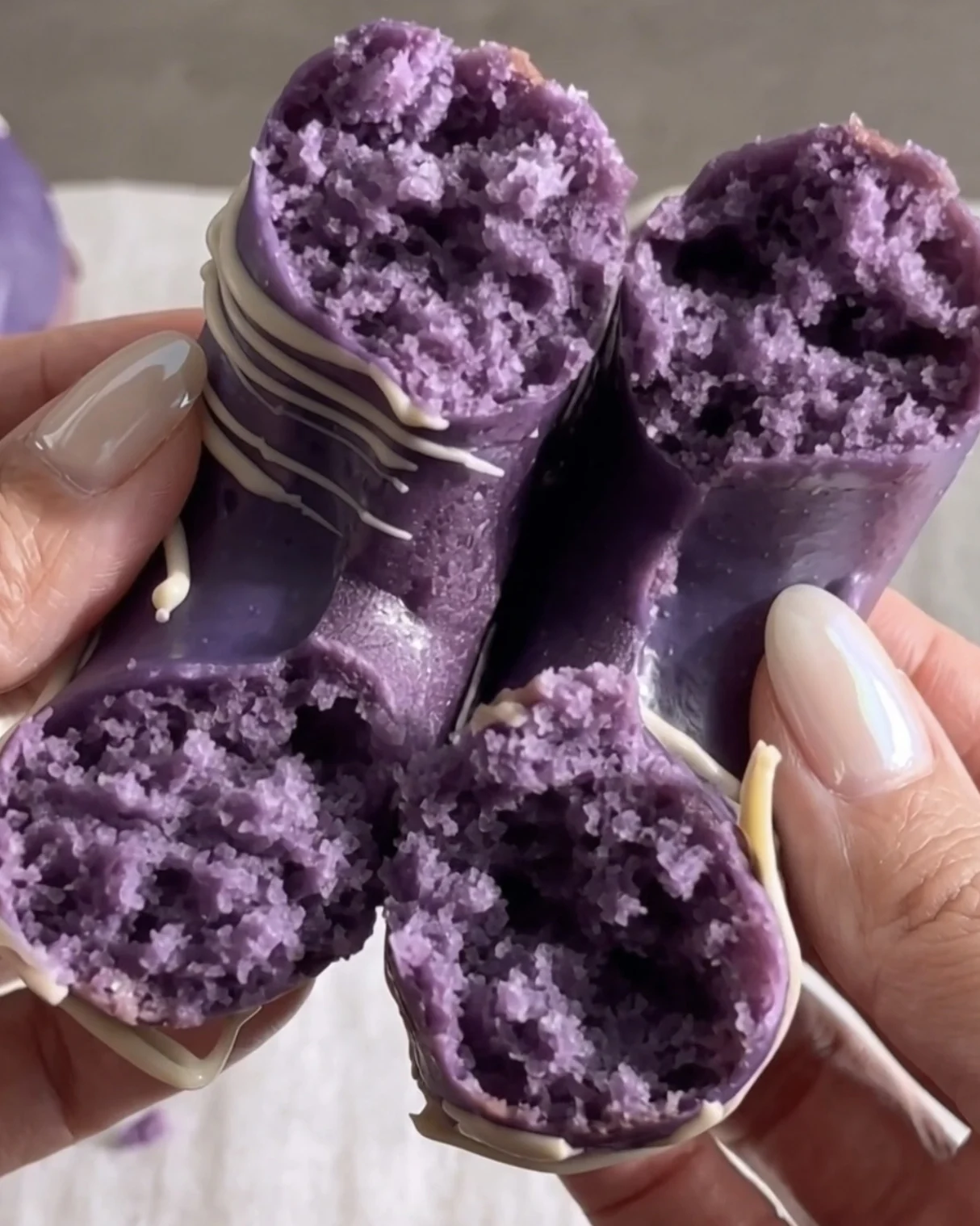 Ube donuts cut open showing the soft purple crumb | Ube Nolia