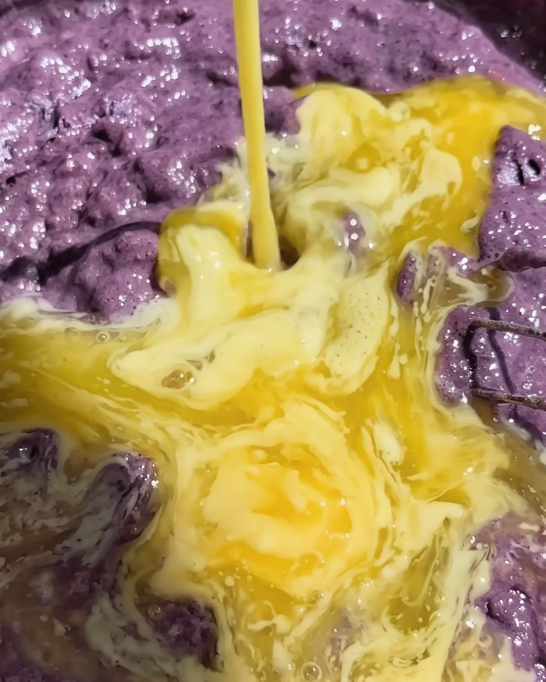 Adding eggs to the purple ube banana bread batter | Ube Nolia